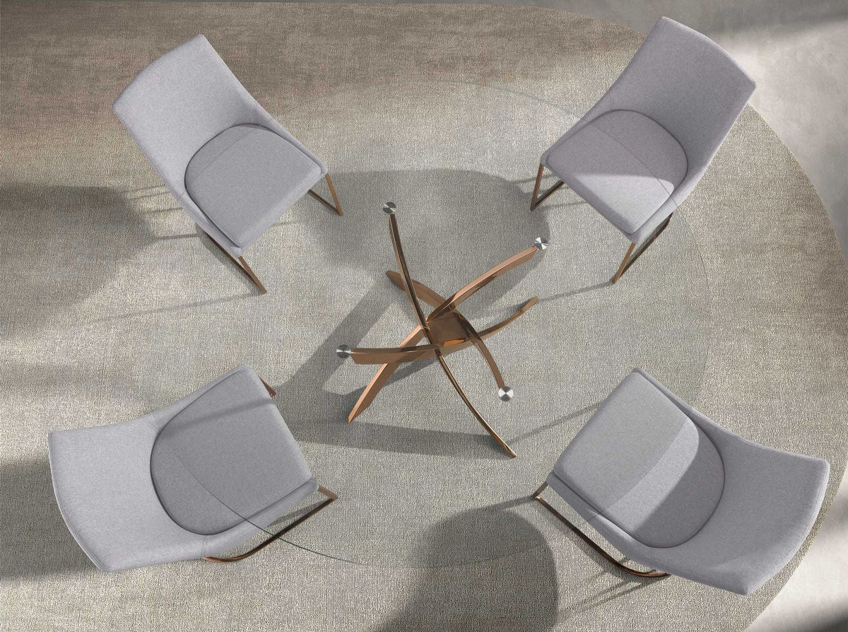 Tempered glass and pink steel round dining table