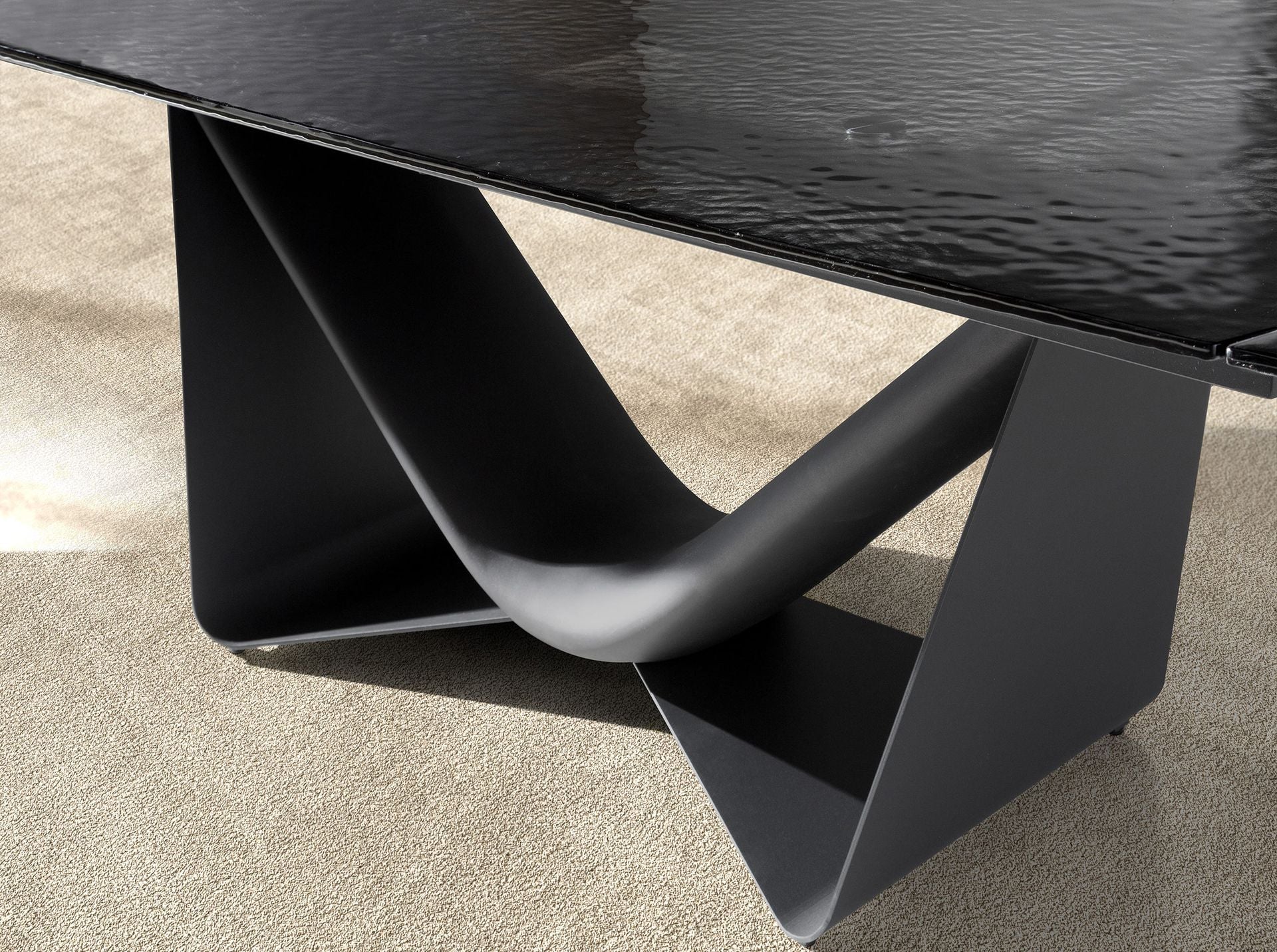 Black glass, steel, dark grey fiberglass and metal oval barrel extendable dining table