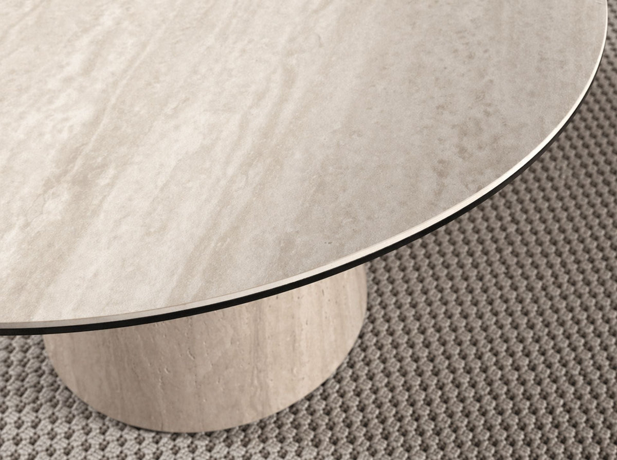 Round dining table in porcelain stoneware and wood clad with a flexible porcelain stoneware laminate