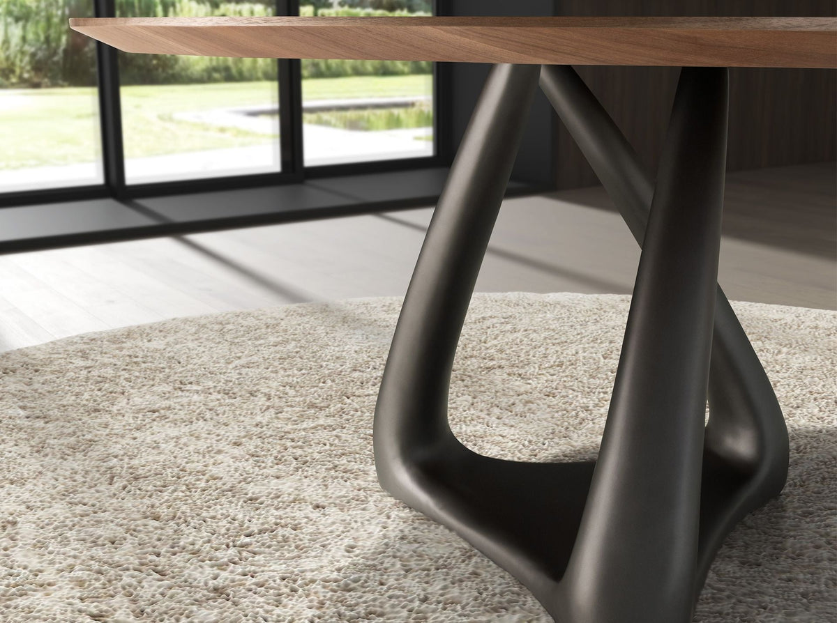 Round dining table in walnut, dark gray fiberglass and metal
