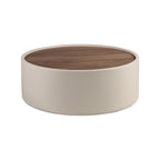Round coffee table in walnut and sand-colored faux leather-covered wood