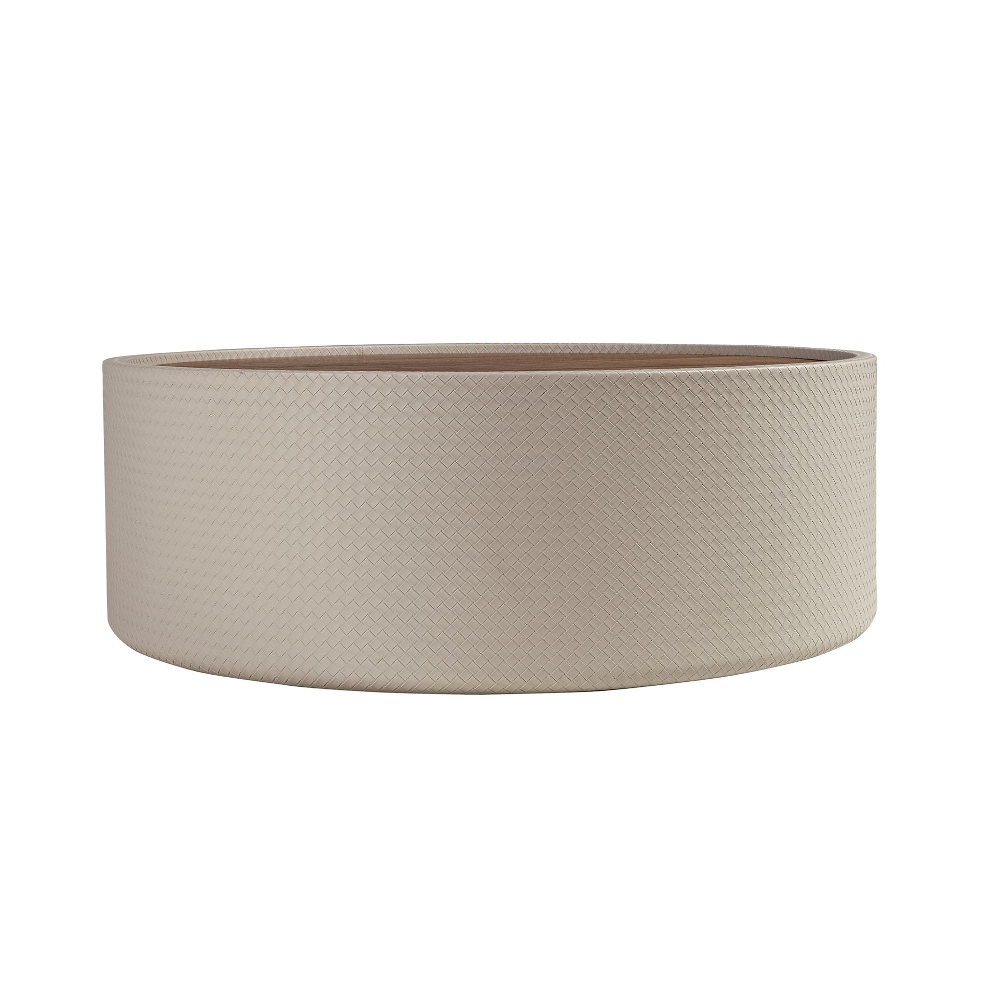 Round coffee table in walnut and sand-colored faux leather-covered wood