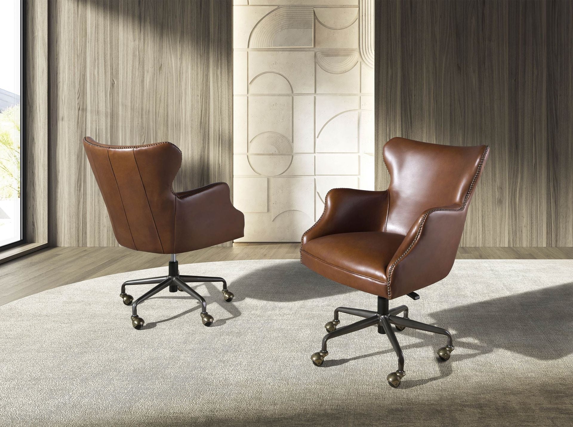Dark brown leather swivel armchair