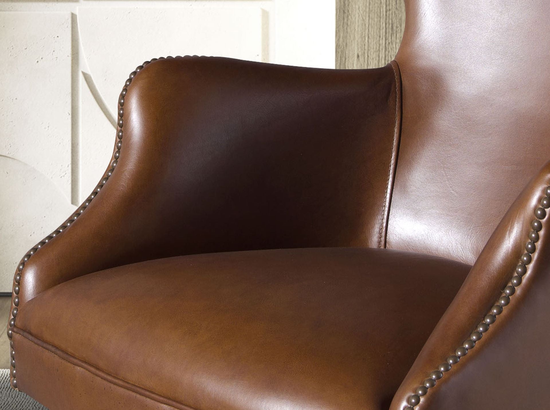 Dark brown leather swivel armchair