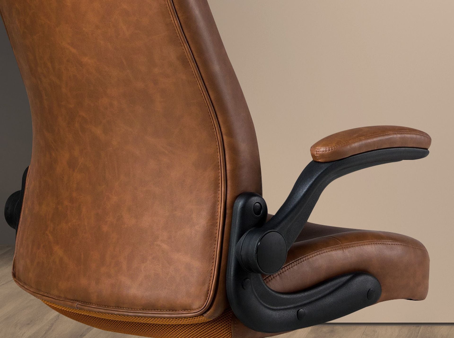 Brown faux leather swivel office chair