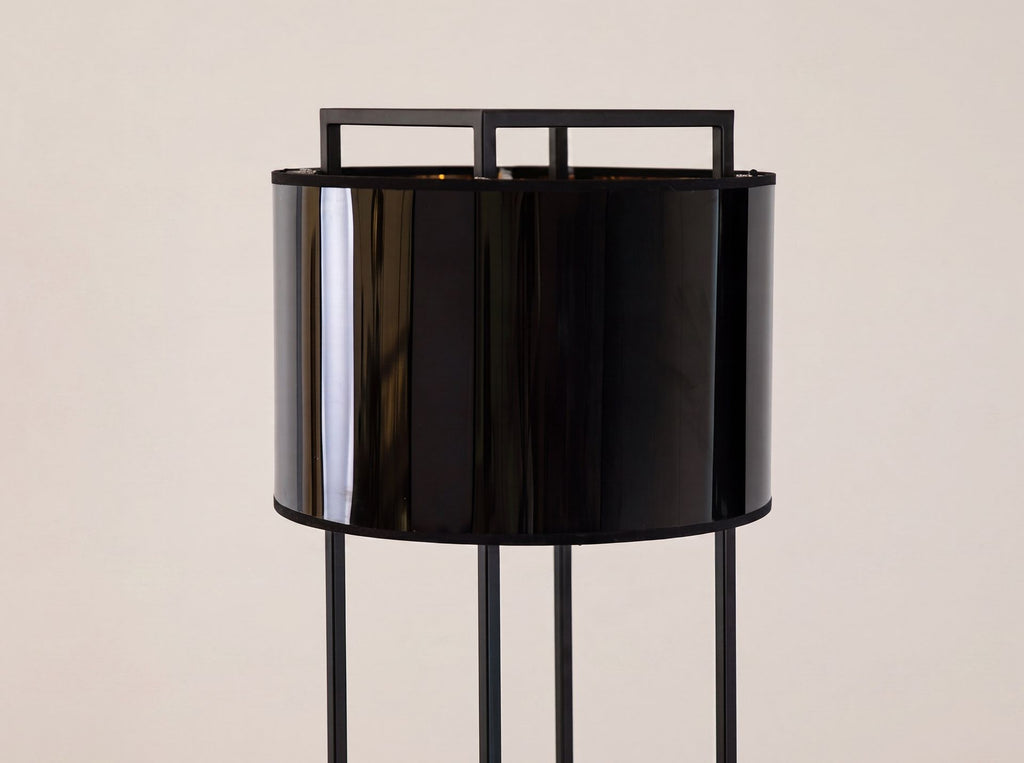 Floor lamp in black and polished gold PVC and black steel