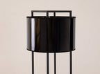Floor lamp in black and polished gold PVC and black steel