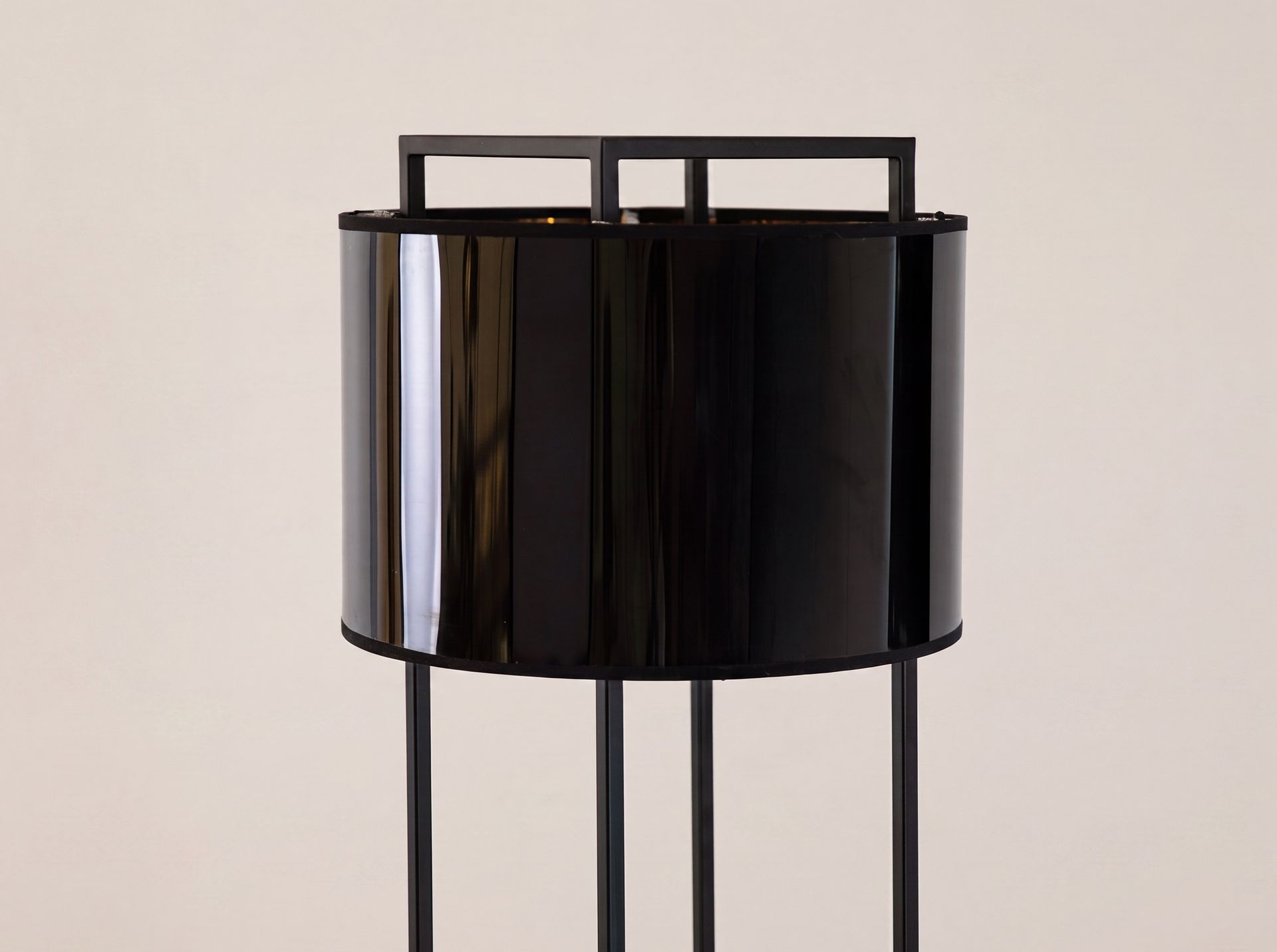 Floor lamp in black and polished gold PVC and black steel