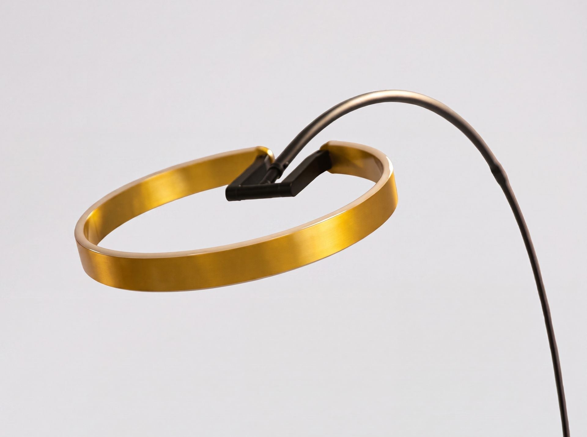 Polished golden steel and black steel floor lamp