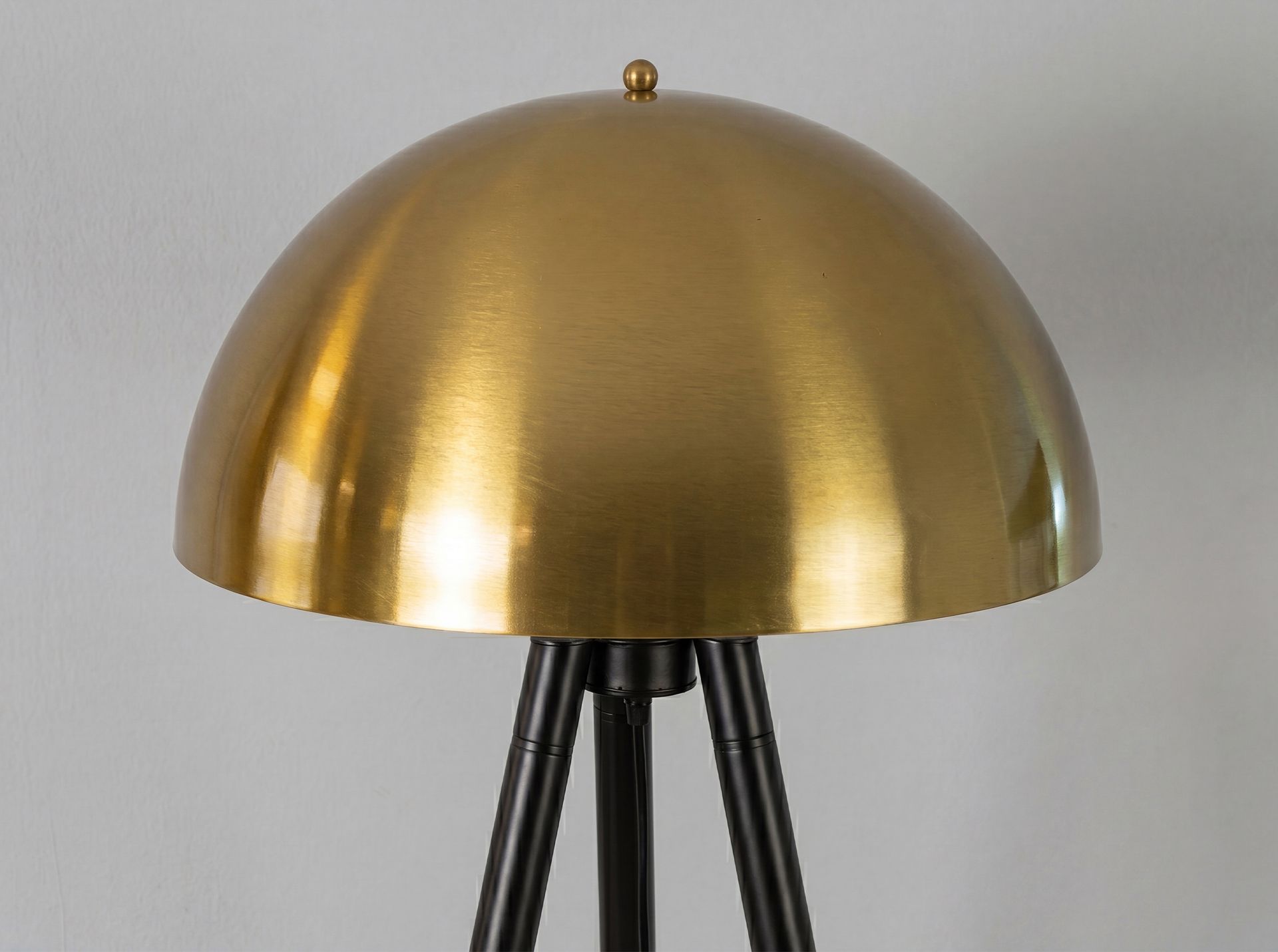 Floor lamp in polished golden steel and black steel